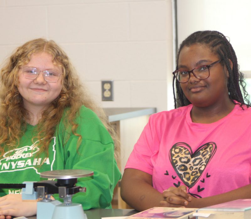 Two eighth graders during RPI Ambassador day working on a project.