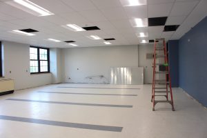 An unfurnished middle school science classroom.